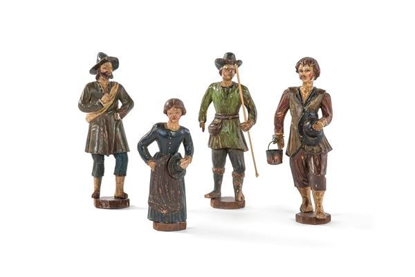 Quattro statuine in legno poli