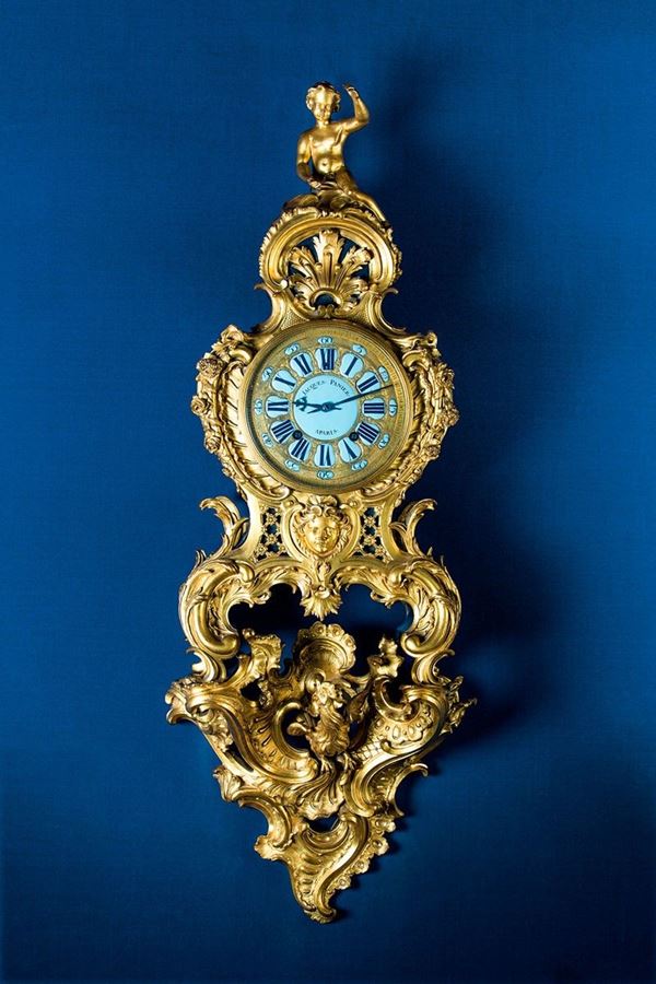 Importante orologio con mensol
