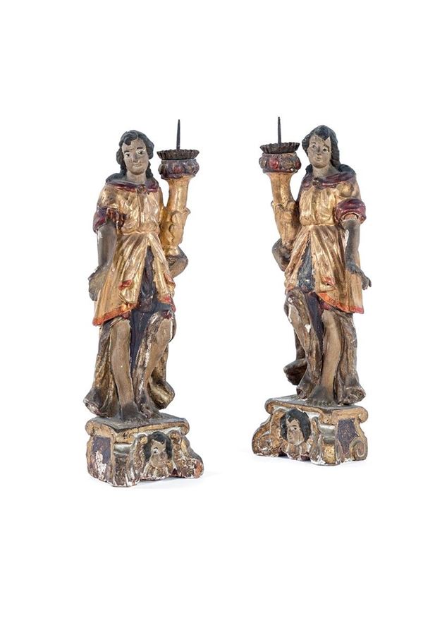 Coppia di sculture reggitorcia