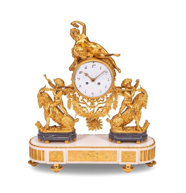 Orologio in bronzo dorato. 
Q