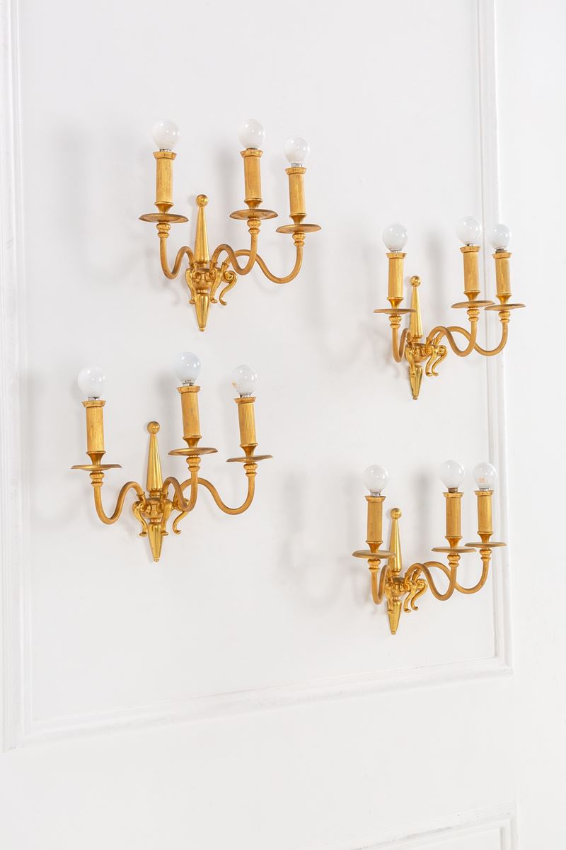 Quattro lampade da parete a tre bracci