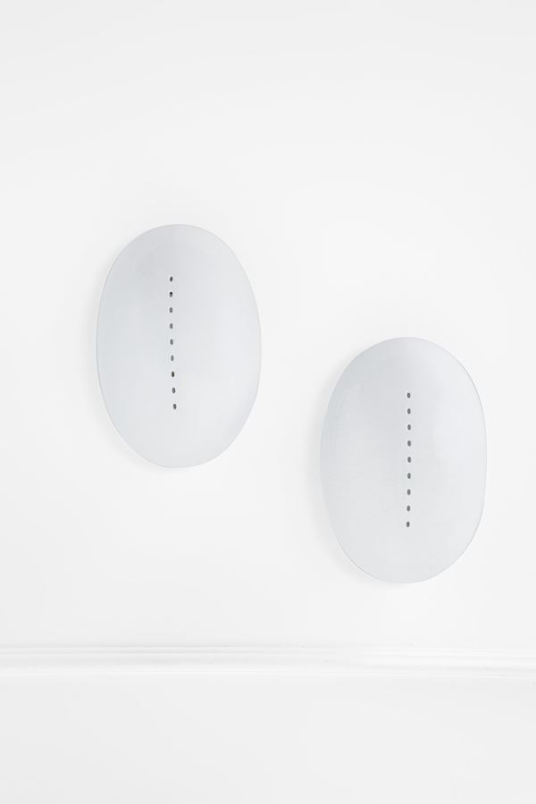 Due lampade da parete omaggio a Lucio Fontana
