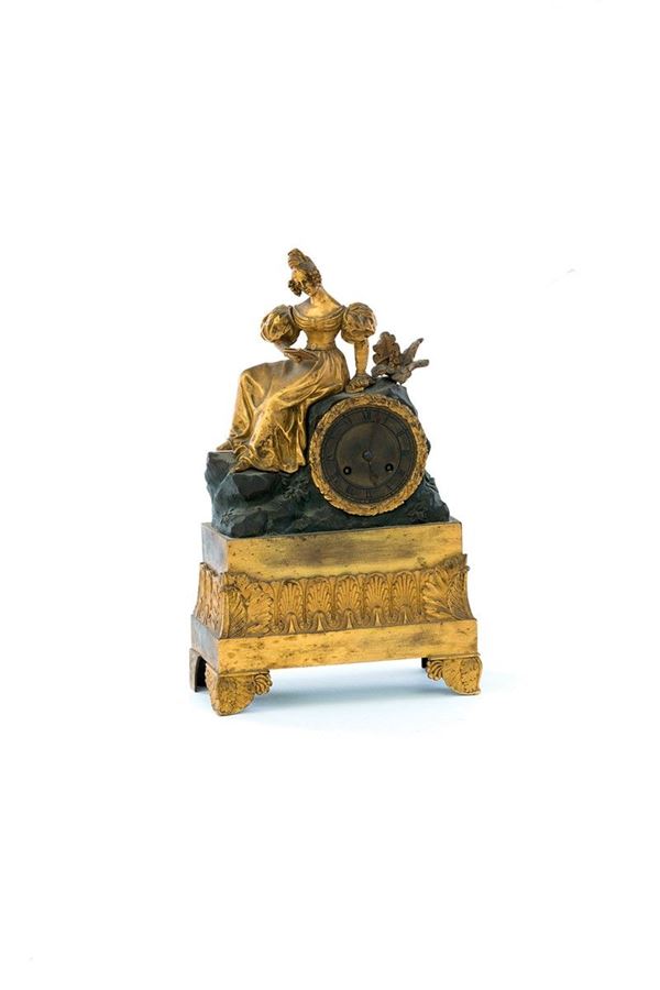 Orologio in bronzo con figura 